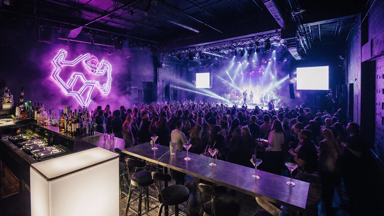 Three‑floor interior of Electric Brixton showing bar, mezzanine dance floor, and main stage with lights.