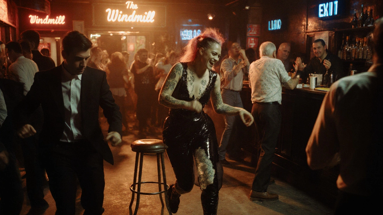 Diverse group of people dancing together in a gritty, welcoming venue with neon lighting.