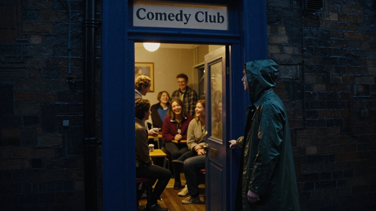 A person hesitating at the doorway of a warmly lit comedy club in a rainy London alley.