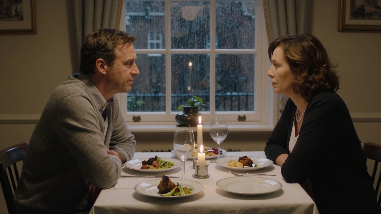 A man and a mature woman share a silent, tender moment at a candlelit dinner in a cozy London home.