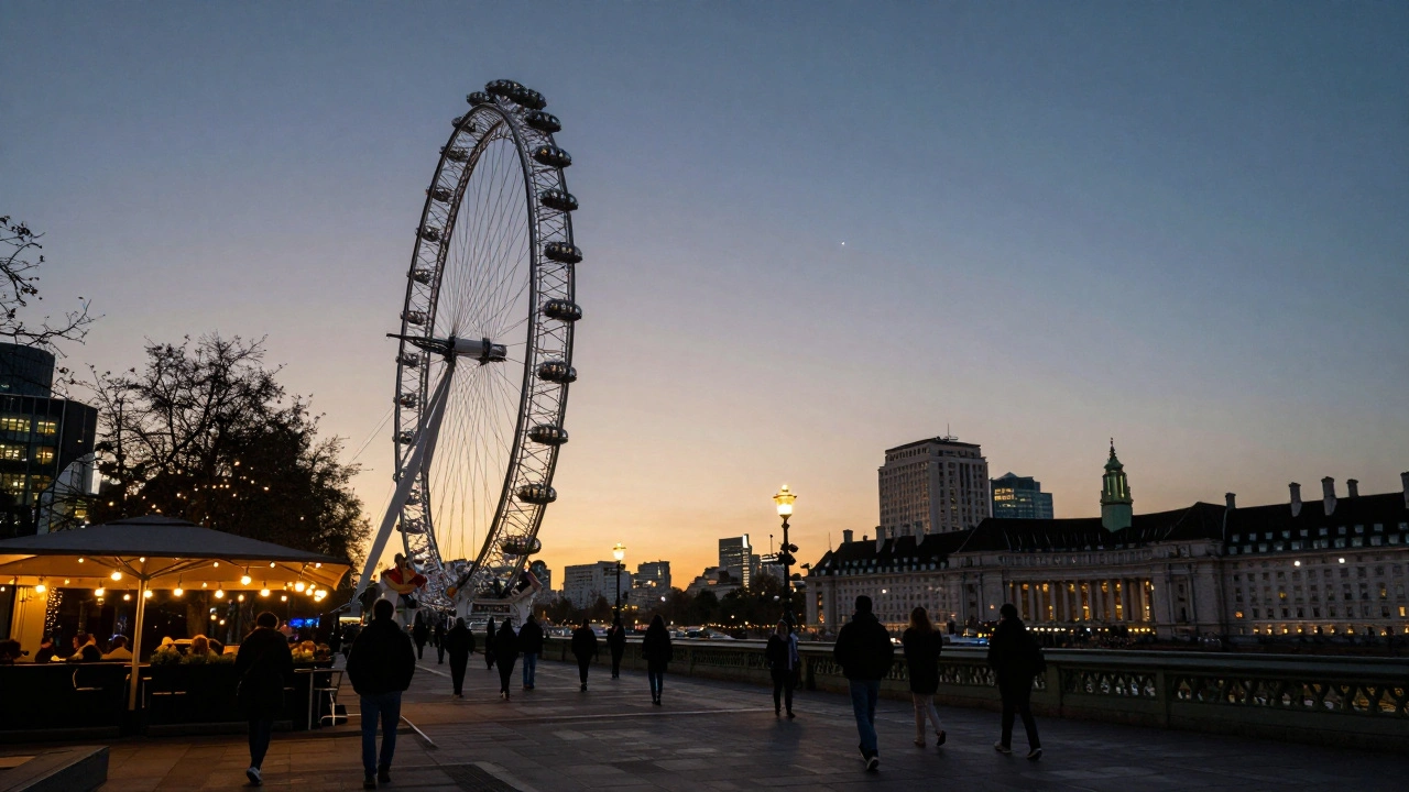 The London Eye at twilight, one capsule glowing above the South Bank as city lights begin to twinkle.