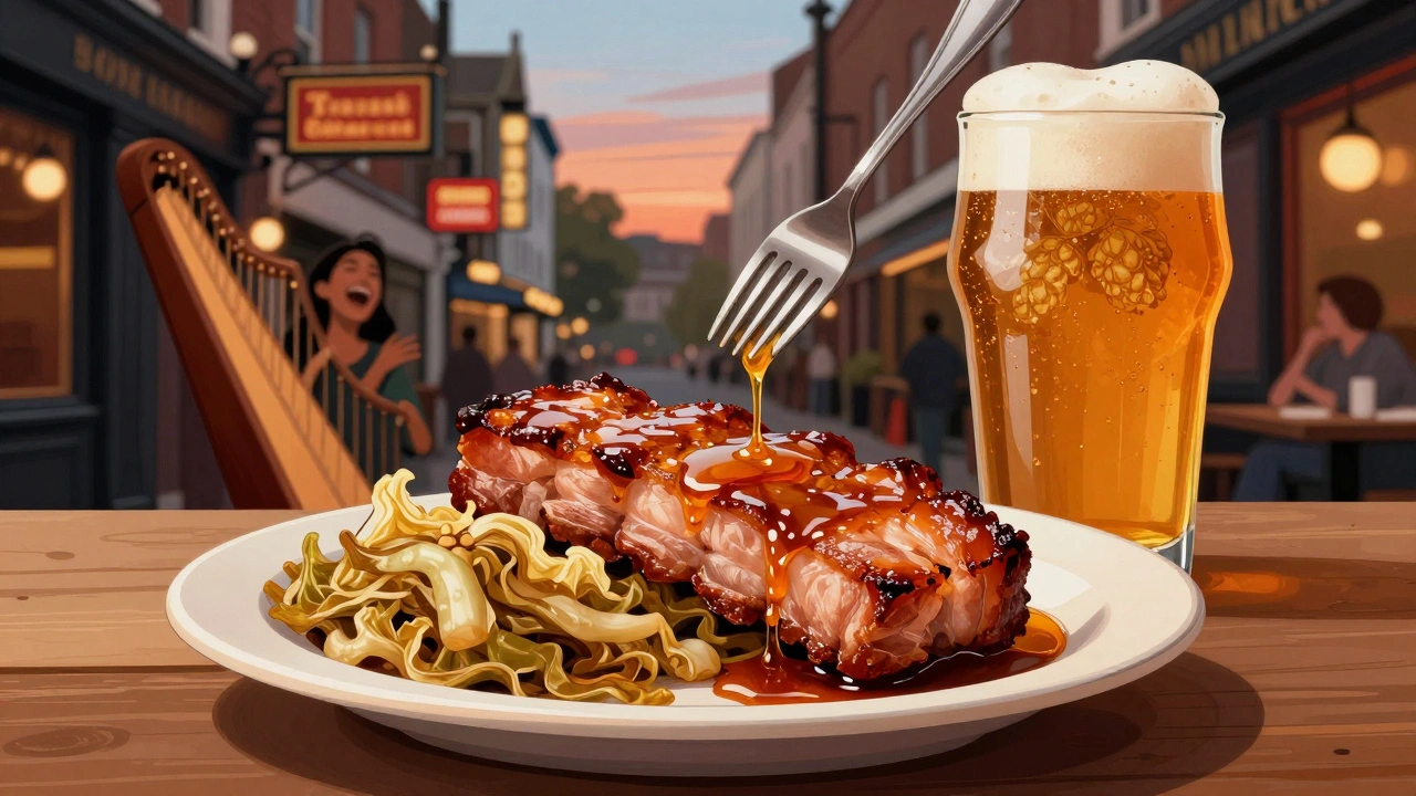 Crispy pork belly with honey glaze paired with a frothy IPA on a rustic pub table.